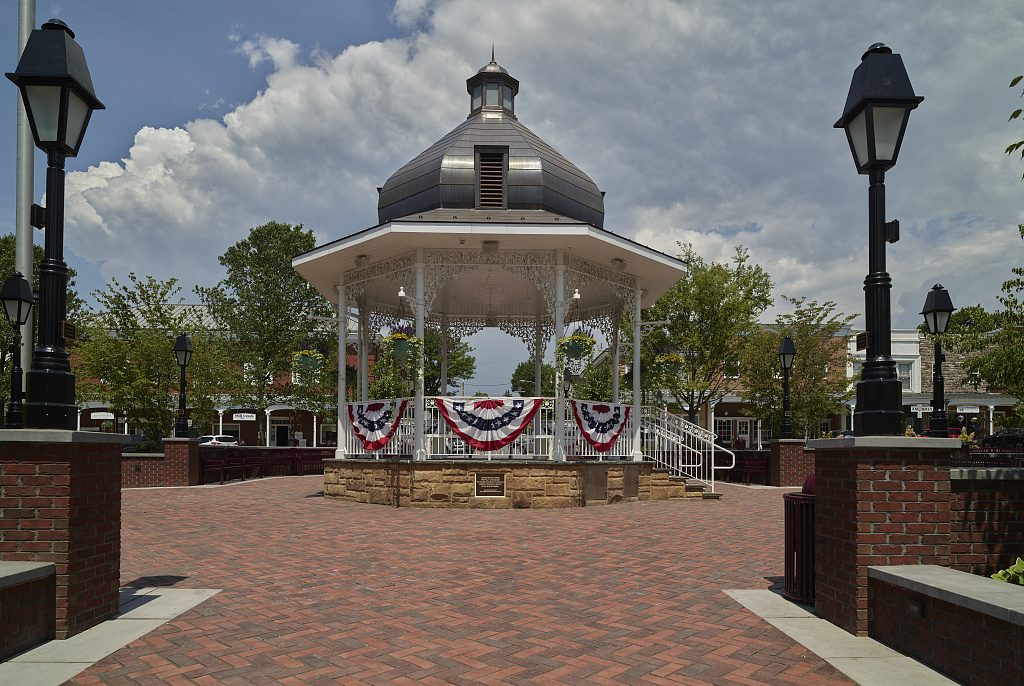 The bandstand gazebo on Founders Square with red, white, and blue bunting